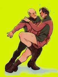 
        Picard is holding up skant-wearing Q
      