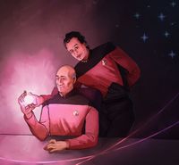 
        Q leans over Picard's shoulder and offers him a pink miniature star with heart flares.
      