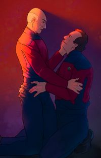 
        Picard and Q are on their knees, holding each other, in a sunset-lit room.
      